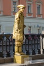 Actor-mime in the image of a living statue on the embankment of the Griboedov Canal. Saint-Petersburg