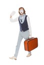 Actor mime waves his hand with orange suitcase