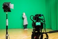 The actor starred in the interior on a green background. The chroma key. Filming equipment Royalty Free Stock Photo