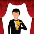 Actor wearing tuxedo holding gold star award Royalty Free Stock Photo