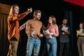 Actors and actresses rehearsing on stage