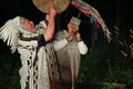 Actors in costumes of South American shamans.