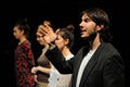 Actors dressed in business suit, of the Barcelona Theater Institute, sing and dance in the comedy Shakespeare For Executives
