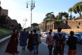 Actors dressed like anciant Roman Gladiators are walking down Roman streets near Coliseum.