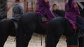 Actors dressed in medieval costumes playing roles of envoys on horseback