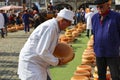 Actors playing the traditional cheese market in Gouda with farmer and buyer negotiation