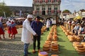 Actors playing the traditional cheese market in Gouda with farmer and buyer negotiation