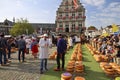 Actors playing the traditional cheese market in Gouda with farmer and buyer negotiation