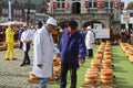 Actors playing the traditional cheese market in Gouda with farmer and buyer negotiation