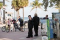 Actors playing Trump and Kim Jong-Un hold `Fake News` poster. Fort Lauderdale Beach