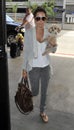 Actress Ashley Tisdale with puppy at LAX