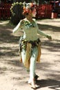 An actress dressed as a green fairy performs a dance at the annual Bristol Renaissance Faire Royalty Free Stock Photo