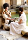 Actresses in costume at Roman Baths, Bath, England Royalty Free Stock Photo