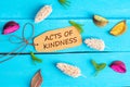 Acts of kindness text on paper tag