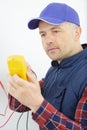 actual electrician working on industrial power distribution center