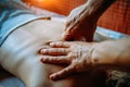 Acupressure massage in spa centre. Woman at acupressure back massage, masseur`s hands close up. Body therapy for healthy lifestyl Royalty Free Stock Photo