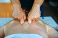 Acupressure massage in spa centre. Woman at acupressure back massage, masseur`s hands close up. Body therapy for healthy lifestyl Royalty Free Stock Photo