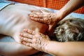 Acupressure massage in spa centre. Woman at acupressure back massage, masseur`s hands close up. Body therapy for healthy lifestyl Royalty Free Stock Photo