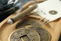 Acupuncture needles, moxa stick and antique Chinese coins on wooden tray, closeup Royalty Free Stock Photo