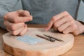 Acupuncture treatment on man`s hands, needles.