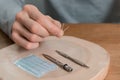 Acupuncture treatment on man`s hands, needles.