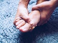 Acute foot pain of thai Asian women, Using hand massage on feet to relieve severe sore feet. Medical health care concept Royalty Free Stock Photo