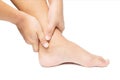 Acute pain in ankle. hand massage ankle isolated white Royalty Free Stock Photo