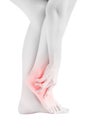 Acute pain in a woman ankle isolated on white background. Clipping path on white background. Royalty Free Stock Photo