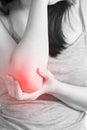 Acute pain in a woman elbow isolated on white background. Clipping path on white background. Royalty Free Stock Photo