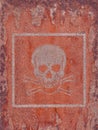 Acute toxicity.Hazard symbol.Mark from an old sticker on a rusty metal surface.