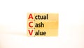 ACV actual cash value symbol. Concept words ACV actual cash value on wooden blocks on a beautiful white table, white background.