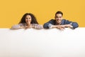 Ad Banner. Smiling Arab Couple Leaning At Blank White Advertisement Board Royalty Free Stock Photo