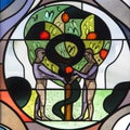 Adam and Eve on stained glass in St. Jodokus Church, Immenstaad, Germany. Royalty Free Stock Photo