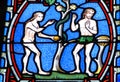 Adam and Eve on the stained glass window Royalty Free Stock Photo