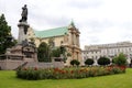 Adam Mickiewicz Monument in Warsaw, Poland with historical buildings in the background