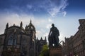 Adam smith Statue, with St. Giles Cathedral in background, in Edinburgh