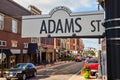 Adams Street Sign with Downtown Muncie Scene Royalty Free Stock Photo