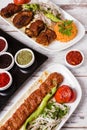 Adana Kebab Served with Green Vegetables in White Plate Royalty Free Stock Photo
