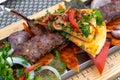 Adana-kebab with vegetables and pita bread - traditional Turkish dish Royalty Free Stock Photo