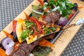 Adana-kebab with vegetables and pita bread - traditional Turkish dish Royalty Free Stock Photo