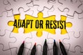Adapt or Resist Concept with Yellow Puzzle Piece and Colored Pencils Royalty Free Stock Photo
