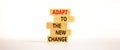 Adapt to the new change symbol. Wooden blocks with words Adapt to the new change on white background, copy space. Business, adapt Royalty Free Stock Photo