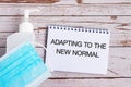Adapting to new normal text on note pad Royalty Free Stock Photo