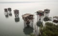 Adapting to rising sea levels with floating city or coastal community on stilts.
