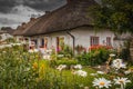 Adare, Ireland. Thatched cottage in the picturesque Village of Adare, Co. Limerick full of flowers in front garden 2019 Ireland,