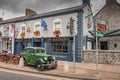 Adare, Limerick, Ireland 2019 View of a typical Irish pub with the blue facade and vintage car in the town of Adare. Europe