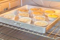 Add all mix ingredients of banana muffins to aluminium mold and bake on oven