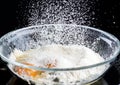 Add eggs and flour to a transparent bowl for making batter.