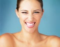 Add some sass to every day. Studio portrait of a beautiful young woman sticking her tongue out against a blue background Royalty Free Stock Photo