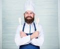 Add some spices. Man with beard in cook hat and apron hold cooking tools. Cooking as professional occupation. Hipster Royalty Free Stock Photo